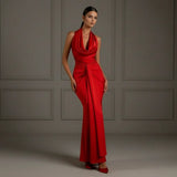 Stylish red evening dress with halter neckline and draped waist, sophisticated luxury fashion photography