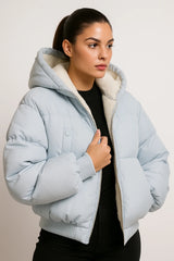 Light blue puffer jacket with hood and faux shearling lining, cozy winter outerwear for women.