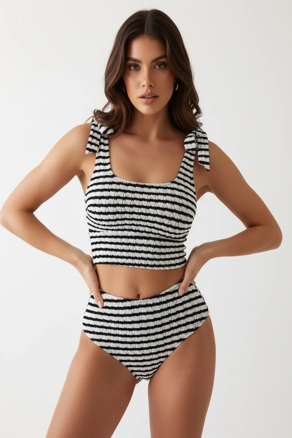 Chic black and white striped bikini set with textured fabric and tie shoulder straps, elegant summer beachwear for women